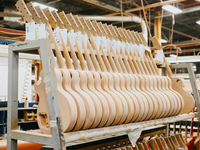 Guitars being manufactured.